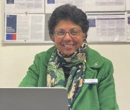 Principal sitting at her desk